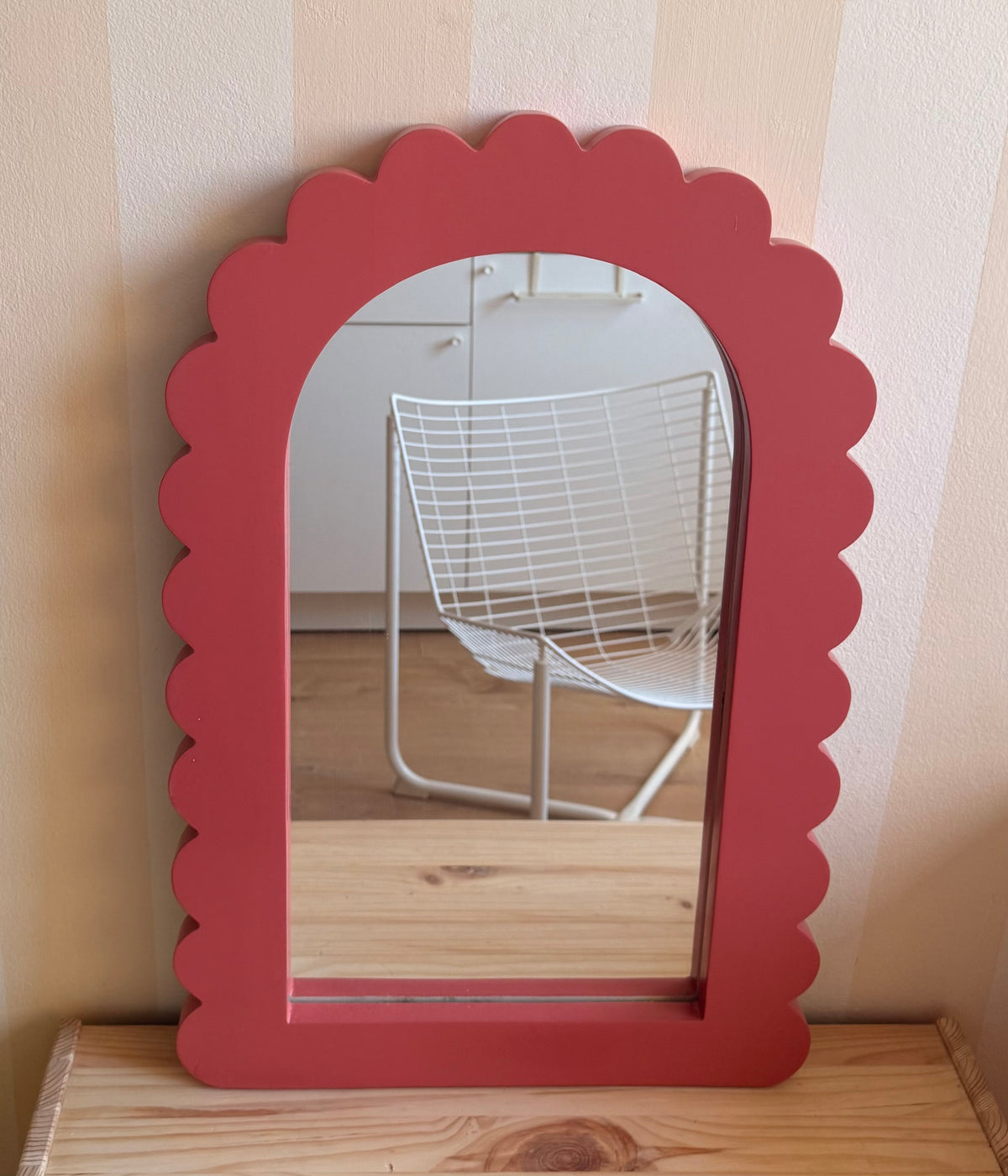 Dusty rose wooden arch mirror with a scalloped frame for a playful kids’ bedroom or nursery.