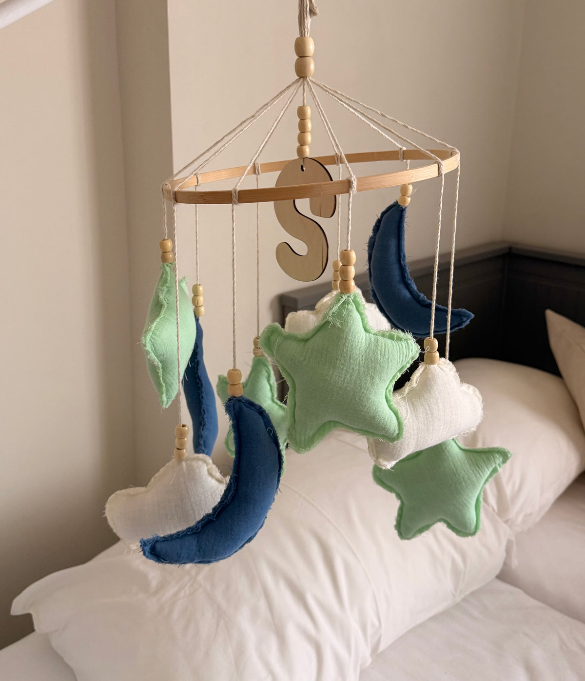 Blue, mint green and white fabric moon and stars baby mobile with natural wooden beads and a personalized wooden initial